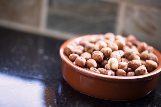 Bowl of hazelnuts with shallow depth of field