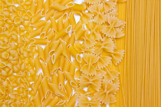 Different types of pasta on white background