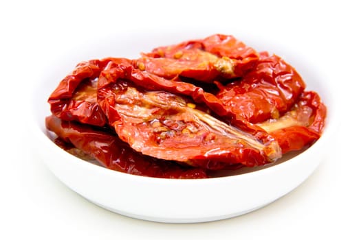 Dried tomatoes on white background