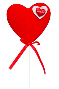 Red heart on  stick isolated over a white background..