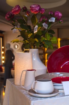 View of ceramic dishes of the elegant table set