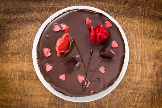 Top view of chocolate cake on the wooden table