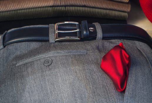 View of red neckerchief on the men's slacks