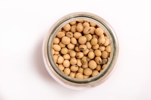 Lots of soybean in a glass pot.