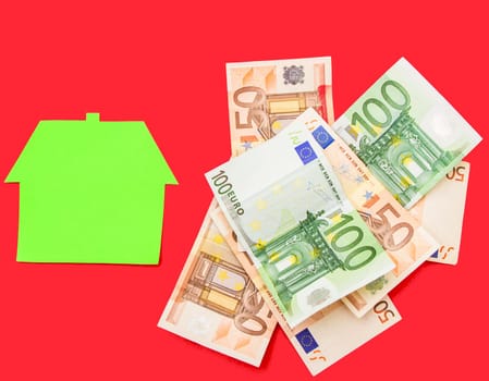 A house over a pile of euros.