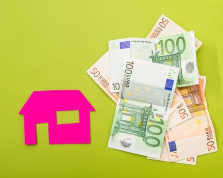 A house near a pile of euros.