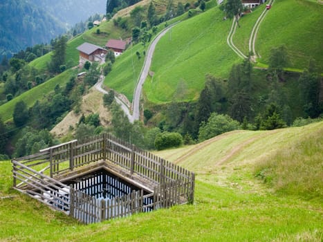 increased views of farmsteads below the mountain village of Videgg in summer