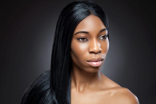 Young black beauty with long straight hair
