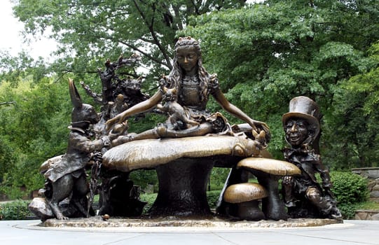 The Alice in Wonderland sculpture, Central park New York. Is a favorite feature among children, who love to climb atop it and explore its varied textures and hiding spaces..