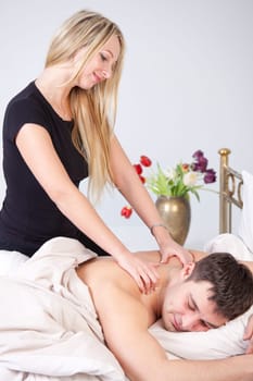 Man receiving relax massage relax treatment from a woman