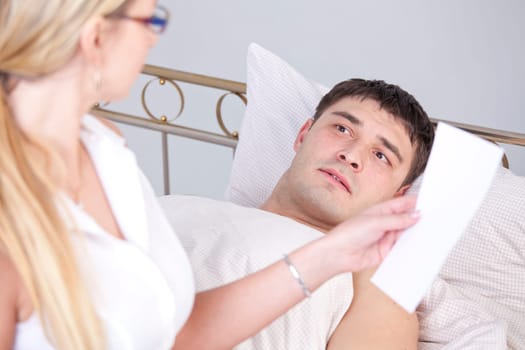 Shocked man on bed after a diagnostic report