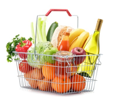 Wire shopping basket with groceries isolated on white