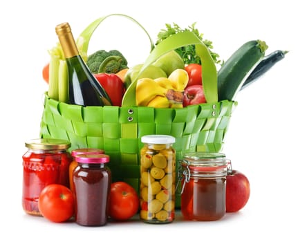 Green shopping bag with groceries isolated on white background