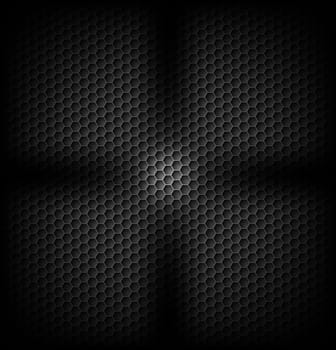Black carbon background with light in fan shape in centre