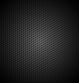 Black carbon background with light in centre