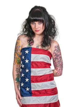 A beautiful young woman wrapped in a flag.