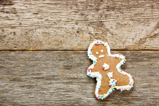 Homemade gingerbread man  on the wooden background