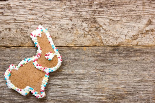 Homemade gingerbread bunny on the wooden background