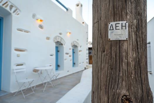 Sign on an electric pole in Paros, Greece