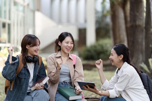 Group of Asian college student happy and celebrate after exam success.