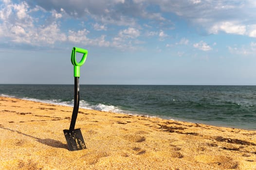 Car shovel for SUVs in the sand on the seashore. Terraforming a sandy beach. Coastal change.