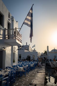 People having dinner in the port of Naoussa, Paros, Greece