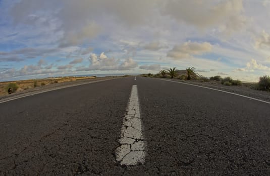 Long Empty Desert Road on a Cludy Day