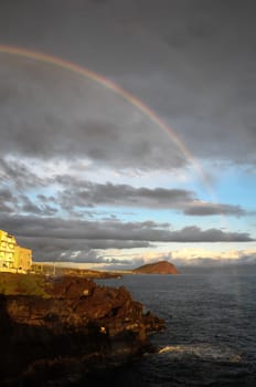 Colored Rainbow over a Cloudy Sky in Tenrife Canary Islands
