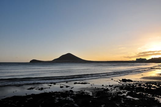 Sunset on the Atlantic Ocean with a Mountain in Background El Medano Tenerife Canary Islands Spain