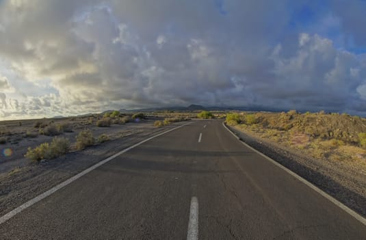 Long Empty Desert Road on a Cludy Day