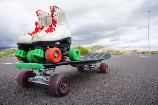 Vintage Style Longboard Black Skateboard on an Empty Asphalt Desert Road