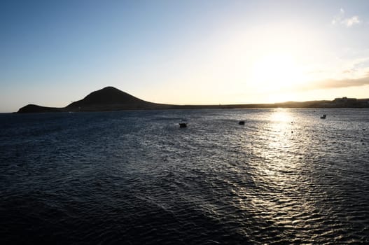 Sunset on the Atlantic Ocean with a Mountain in Background El Medano Tenerife Canary Islands Spain