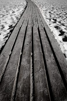 Wooden path through a sandy beach, Greece