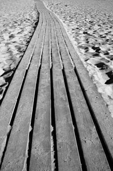 Wooden path through a sandy beach, Greece