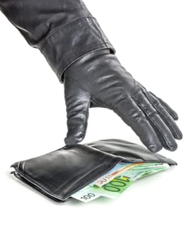 Thief with leather glove reaches for a purse
