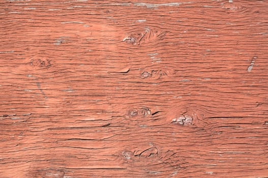 Old weathered plywood surface with faded paint as background