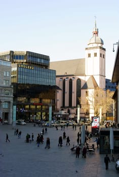 Cologne,Germany – February 02,2014: Tourists and travellers on the station forecourt in Cologne with a view of St. Mary's Assumption Church on 02 February 2014 in Cologne.