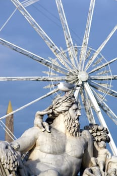 Paris,France – December 29,2013: The sculpture Le Nil,the river god Nile by Lorenzo Ottone with a seagull on his head in the Jardin des Tuileries on 29.02.2013 in Paris.