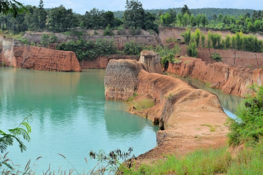 popular quarry pond for swimming and outdoor life, lake at excavation site in Opkhan national park near Chiang Mai, Thailand