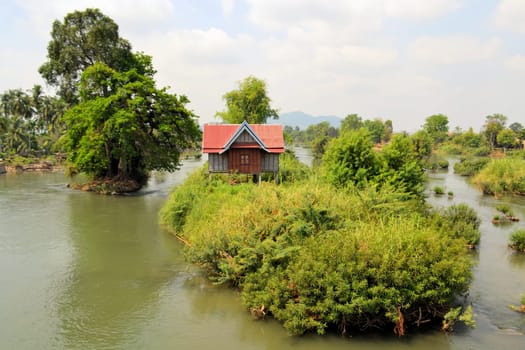 A house on stilts in the middle of the Mekong between the islands of Don Det and Don Khon, Laos