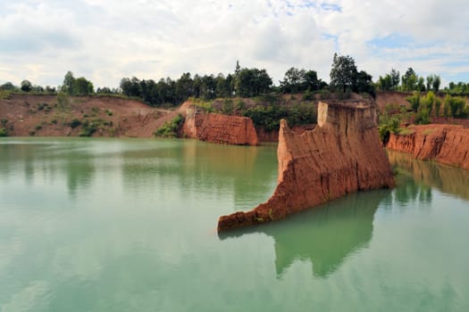 popular quarry pond for swimming and outdoor life, lake at excavation site in Opkhan national park near Chiang Mai, Thailand