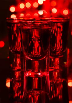 Red cocktail in shot glasses