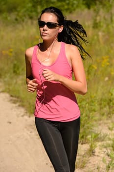 Athlete woman running training on sunny day with sunglasses