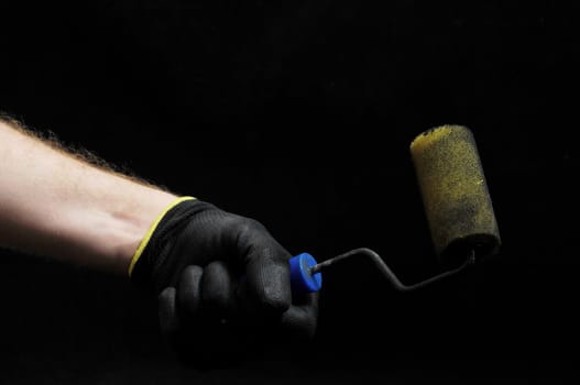 Brush and Hand on a Black Background