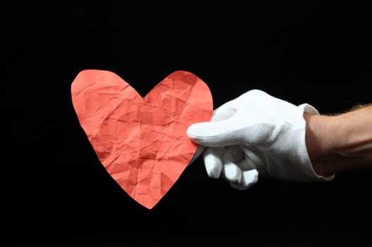 Heart And an Hand on a Black Background