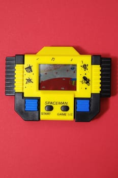 One Old Yellow Vintage Videogame with four Buttons