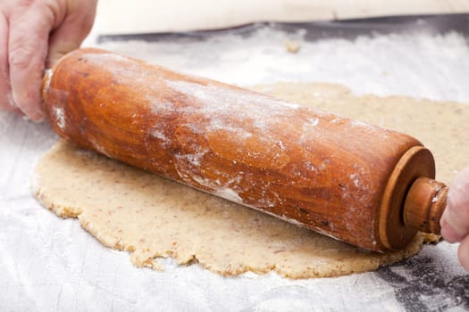 Roll out cookie dough with dough roll