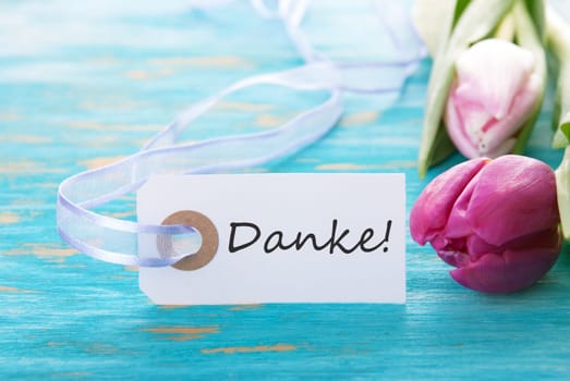 Turquiose Background with the german word Danke which means Thank You