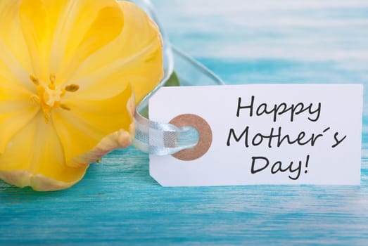 Label with Happy Mothers Day and yellow Blossom