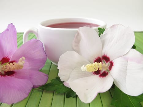 Tea with hibiscus flowers